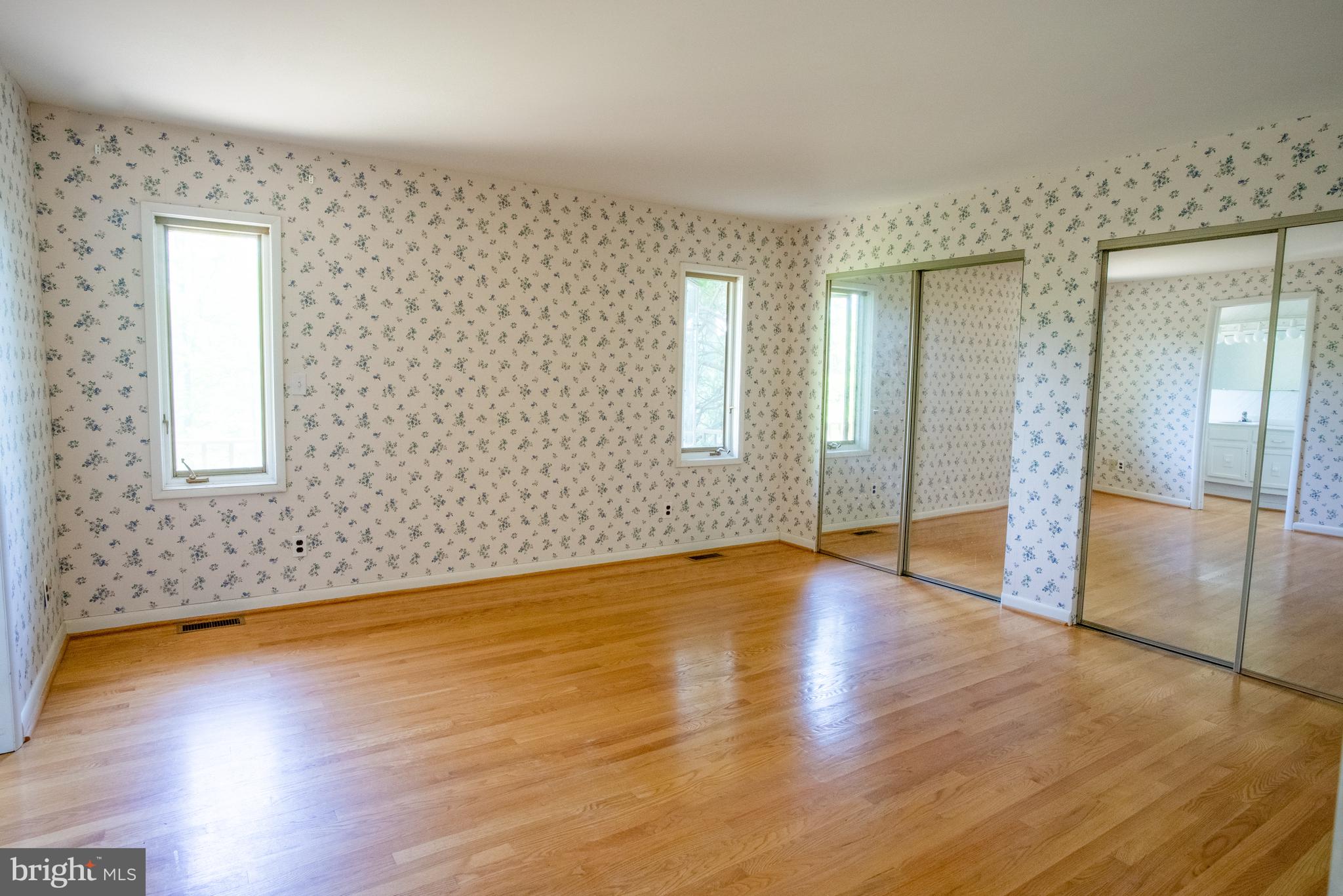 132 Union Church Road Elkton, MD 21921 - Photo 11 of 41 an empty room with wooden floor and windows