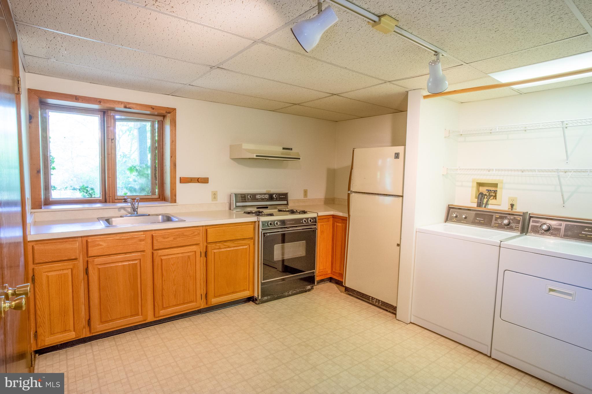 132 Union Church Road Elkton, MD 21921 - Photo 20 of 41 a kitchen with white cabinets and white appliances