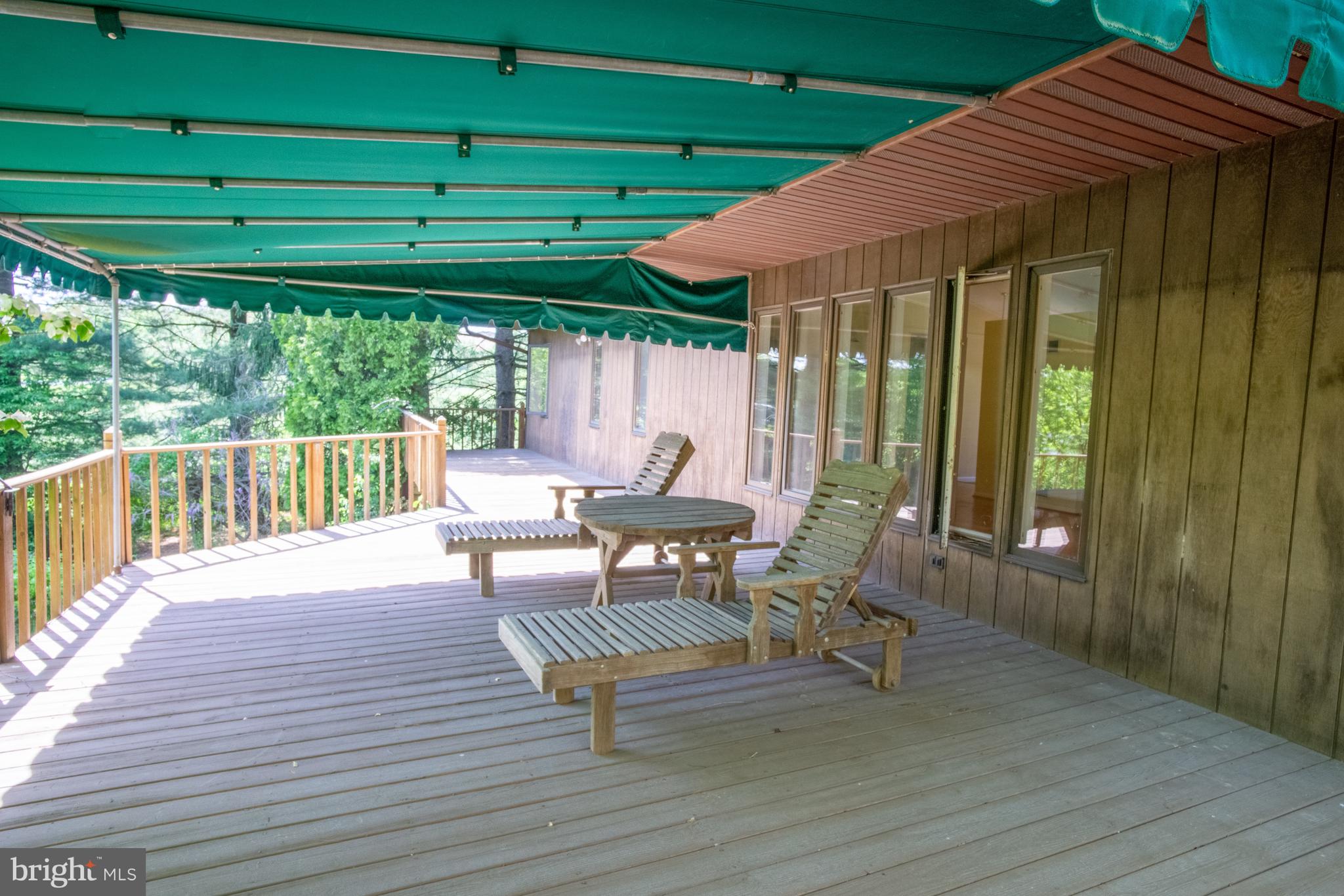 132 Union Church Road Elkton, MD 21921 - Photo 25 of 41 a view of a patio with table and chairs with wooden floor and fence