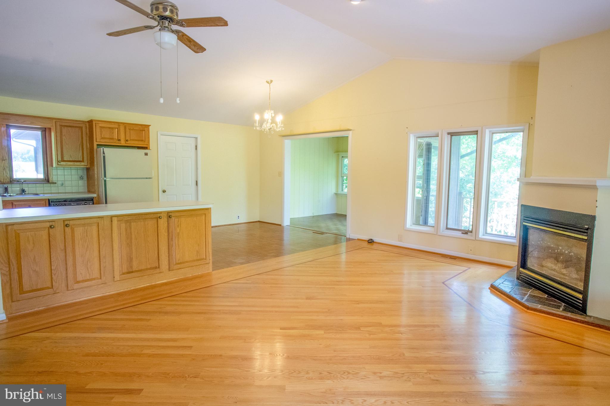 132 Union Church Road Elkton, MD 21921 - Photo 5 of 41 a view of a livingroom with a fireplace a ceiling fan and wooden floor