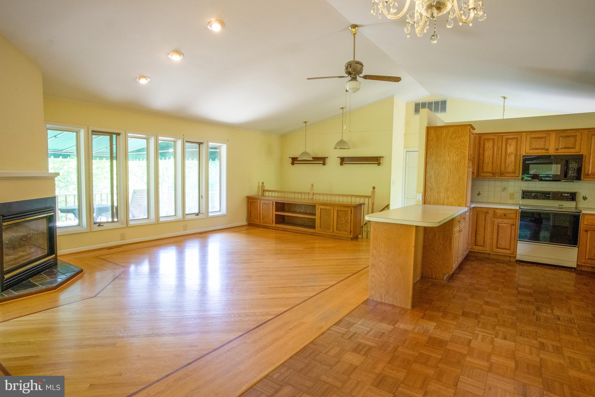 132 Union Church Road Elkton, MD 21921 - Photo 6 of 41 a large kitchen with stainless steel appliances a large counter top a stove and a wooden floors