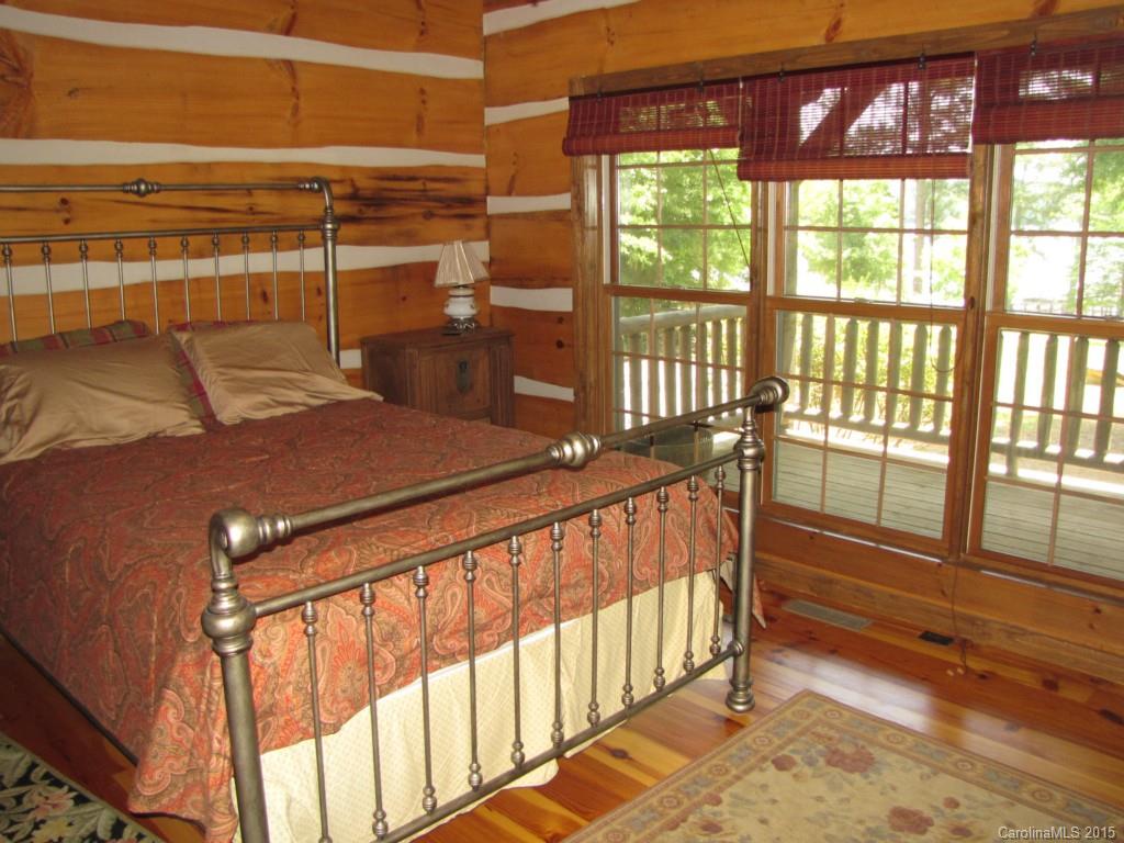 395 Tallow Road, Unit 11 Ridgeway, SC 29130 - Photo 11 of 24 a bedroom with a bed and a large window