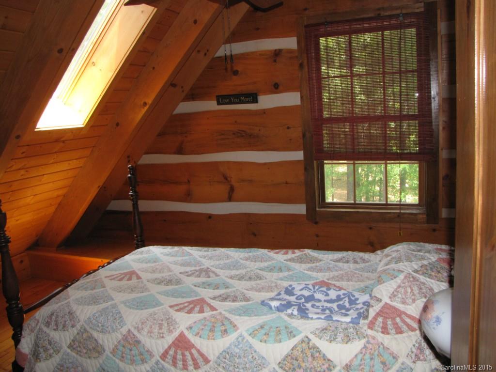 395 Tallow Road, Unit 11 Ridgeway, SC 29130 - Photo 16 of 24 a bedroom with a bed and a window