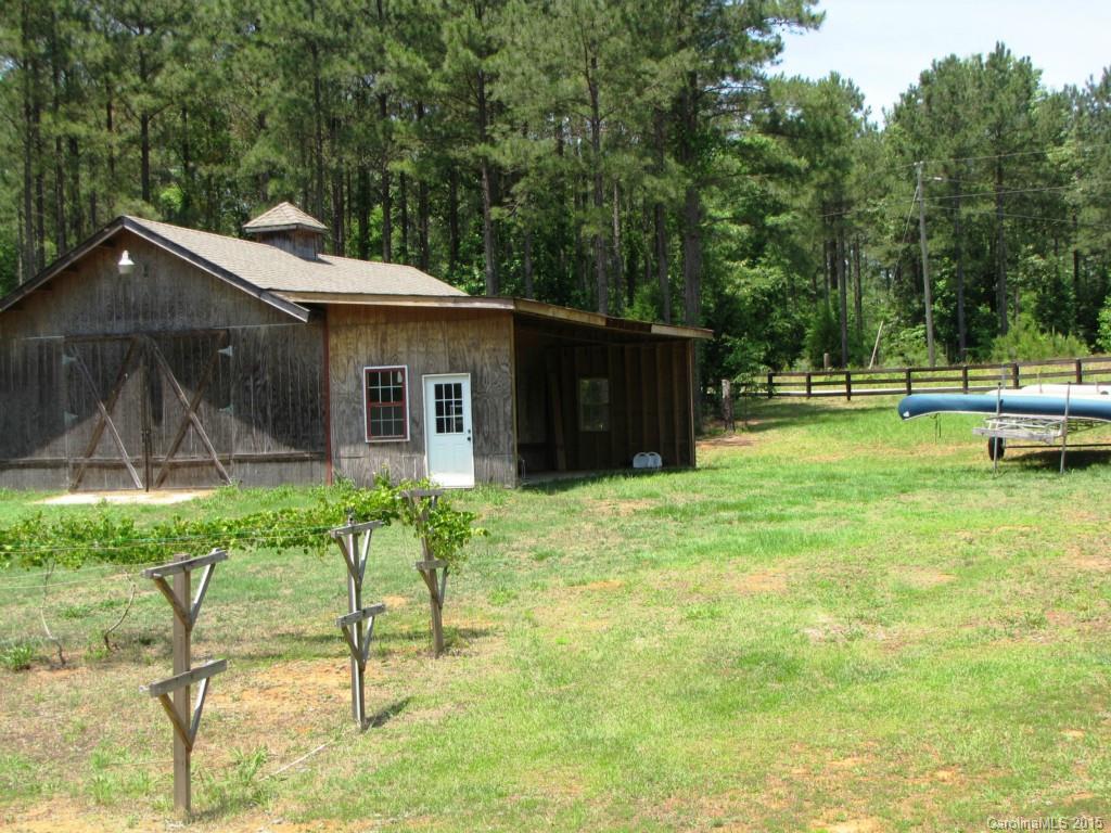 395 Tallow Road, Unit 11 Ridgeway, SC 29130 - Photo 19 of 24 a backyard of a house with table and chairs