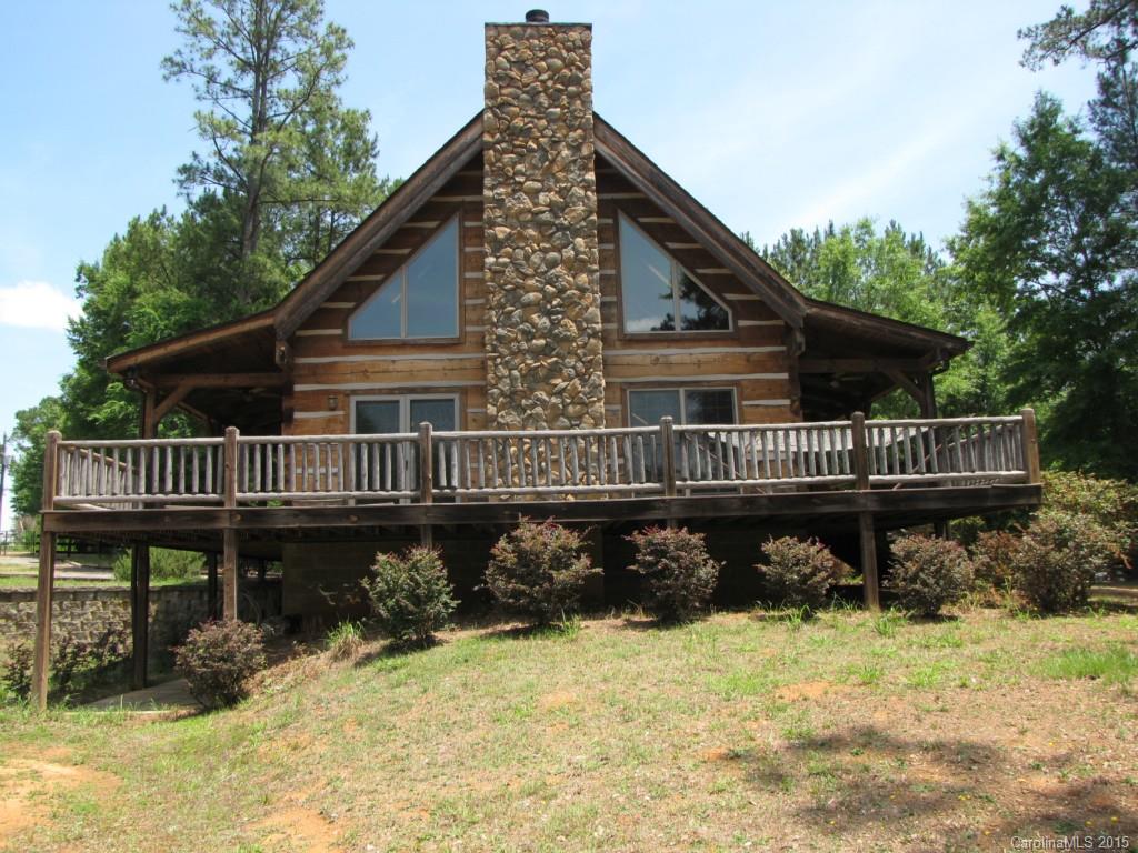 395 Tallow Road, Unit 11 Ridgeway, SC 29130 - Photo 3 of 24 a view of a house with a yard chairs and wooden fence