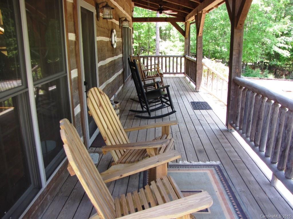 395 Tallow Road, Unit 11 Ridgeway, SC 29130 - Photo 4 of 24 a view of balcony with wooden floor and outdoor seating
