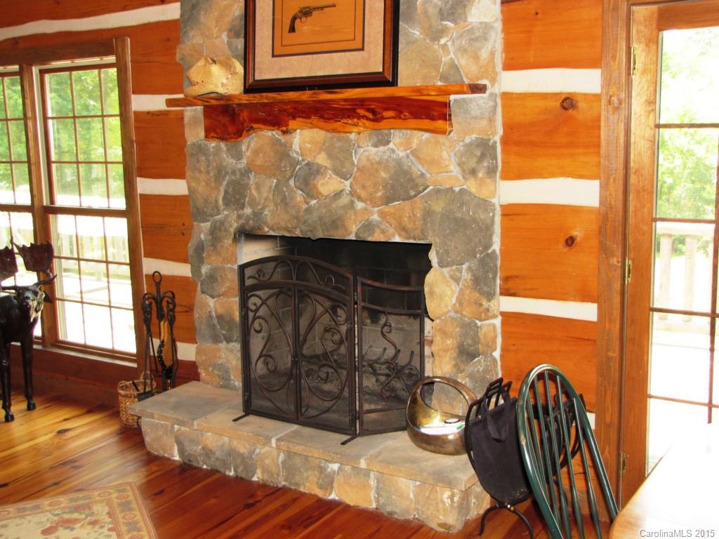 395 Tallow Road, Unit 11 Ridgeway, SC 29130 - Photo 5 of 24 a view of a fireplace with window and wooden floor