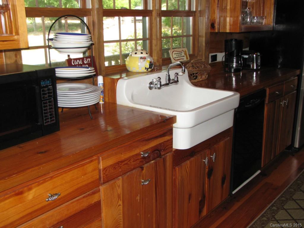395 Tallow Road, Unit 11 Ridgeway, SC 29130 - Photo 8 of 24 a kitchen with a sink and wooden floor