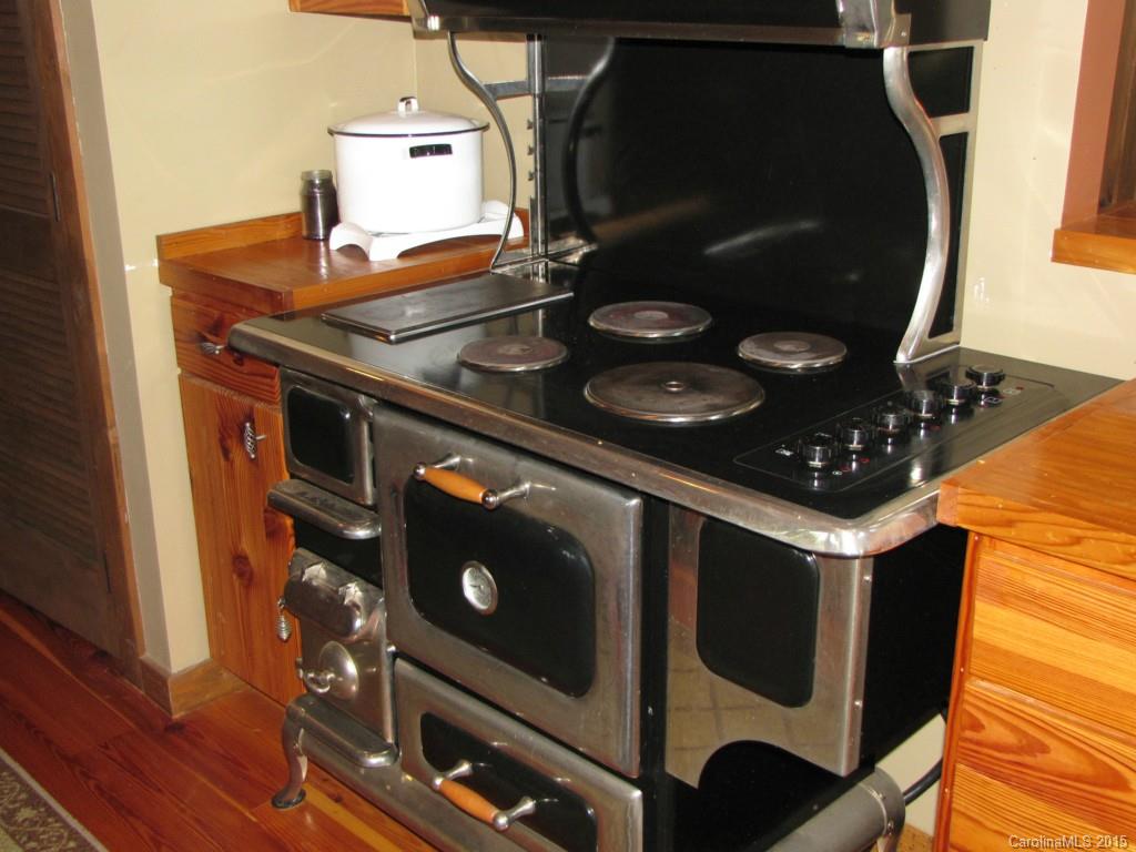395 Tallow Road, Unit 11 Ridgeway, SC 29130 - Photo 9 of 24 a stove top oven sitting inside of a kitchen