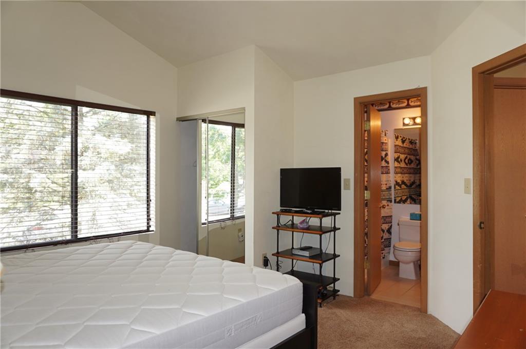 Y12 Sunridge Road Champion, PA 15622 - Photo 11 of 15 a bedroom with a bed and a flat screen tv