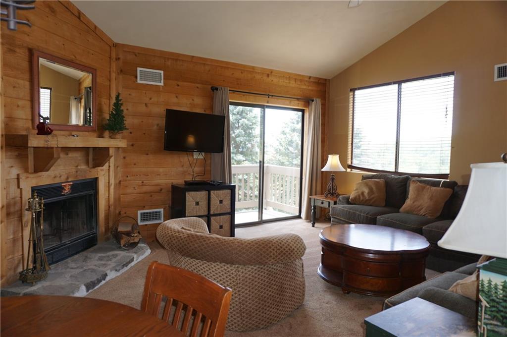Y12 Sunridge Road Champion, PA 15622 - Photo 4 of 15 a living room with furniture a flat screen tv and a fireplace