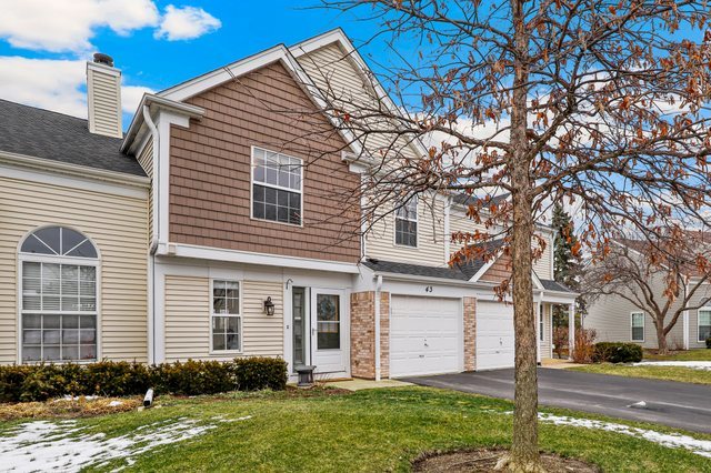 43 North Oltendorf Road Streamwood, IL 60107 - Photo 2 of 22 a front view of a house with garden