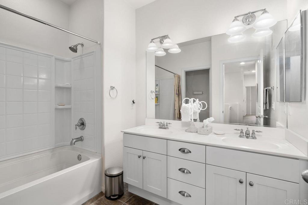 810 Harbor Cliff Way, Unit 225 Oceanside, CA 92054 - Photo 12 of 43 a bathroom with a double vanity sink mirror double and bathtub