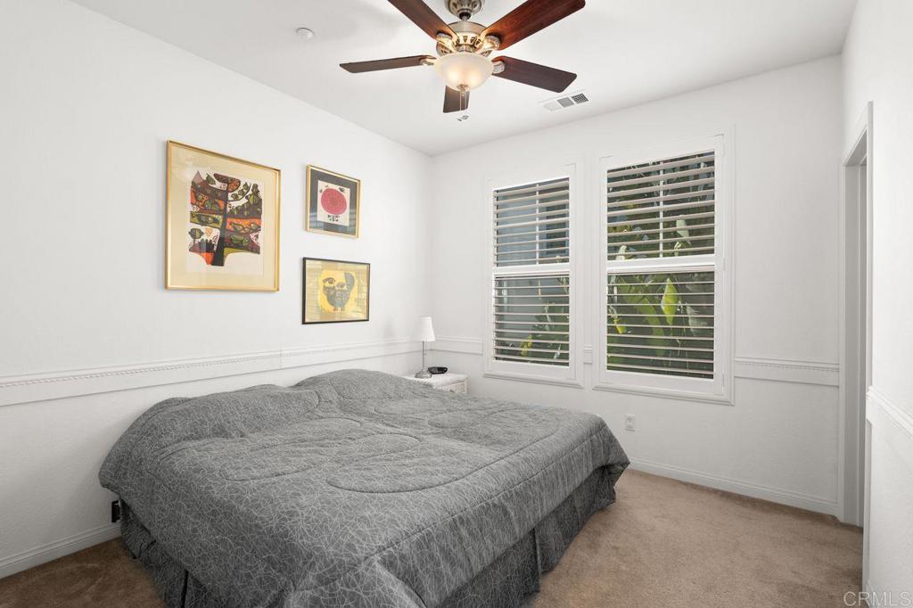 810 Harbor Cliff Way, Unit 225 Oceanside, CA 92054 - Photo 13 of 43 a bedroom with a bed and a window