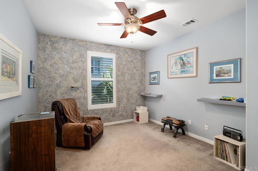 810 Harbor Cliff Way, Unit 225 Oceanside, CA 92054 - Photo 14 of 43 a living room with furniture and a window