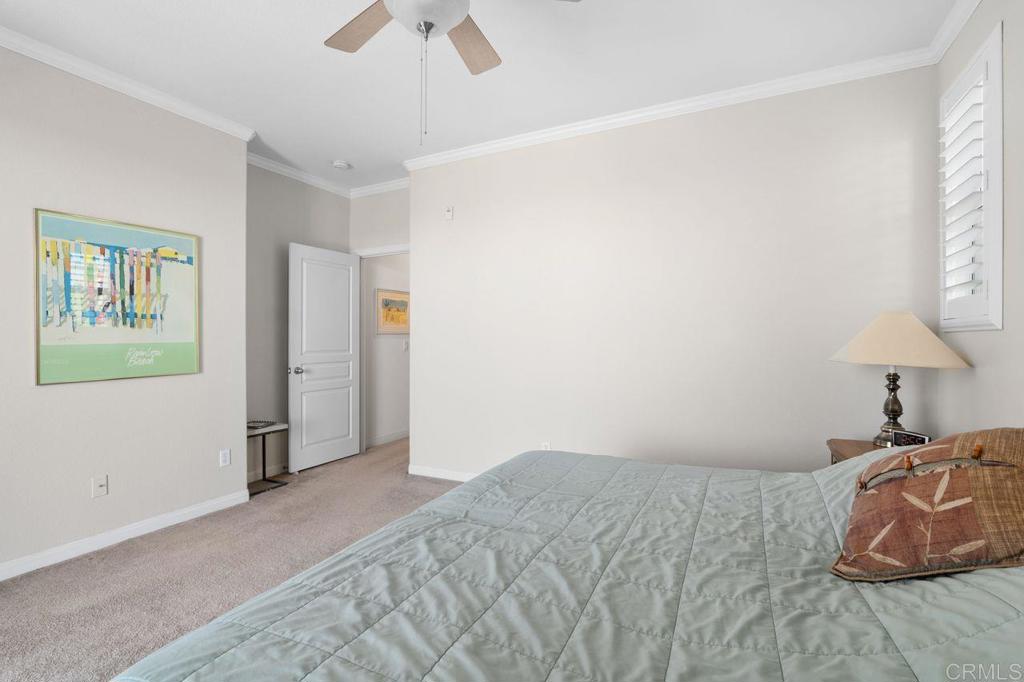 810 Harbor Cliff Way, Unit 225 Oceanside, CA 92054 - Photo 21 of 43 a bedroom with a bed and a window