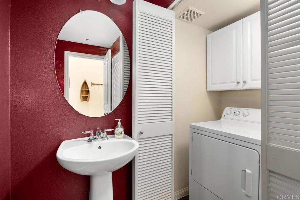 810 Harbor Cliff Way, Unit 225 Oceanside, CA 92054 - Photo 26 of 43 a bathroom with a sink and a mirror