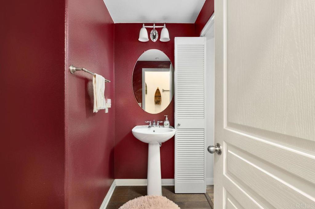 810 Harbor Cliff Way, Unit 225 Oceanside, CA 92054 - Photo 27 of 43 a bathroom with a sink and a mirror