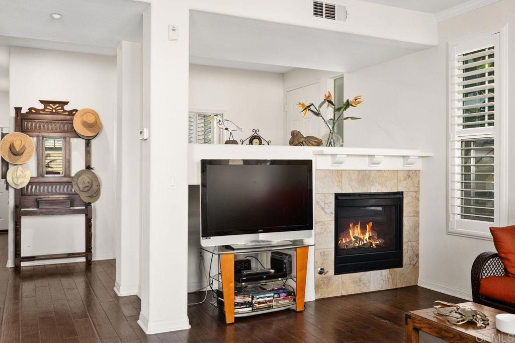 810 Harbor Cliff Way, Unit 225 Oceanside, CA 92054 - Photo 31 of 43 a living room with furniture and a flat screen tv