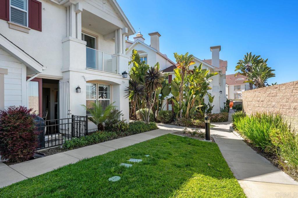 810 Harbor Cliff Way, Unit 225 Oceanside, CA 92054 - Photo 41 of 43 a view of a house with a yard and plants