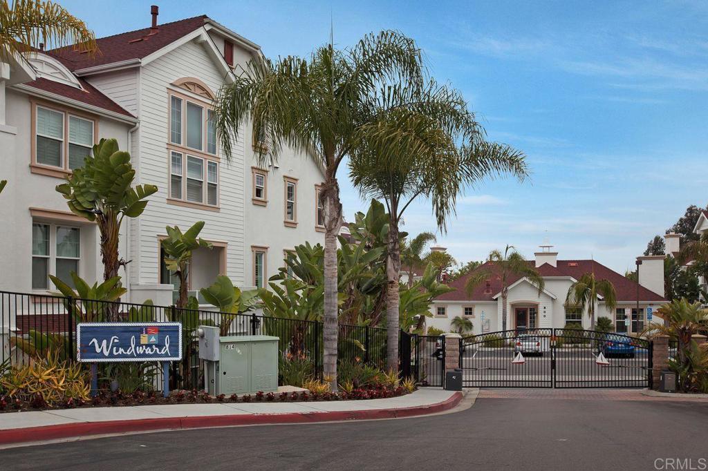 810 Harbor Cliff Way, Unit 225 Oceanside, CA 92054 - Photo 5 of 43 a front view of a house with a garden