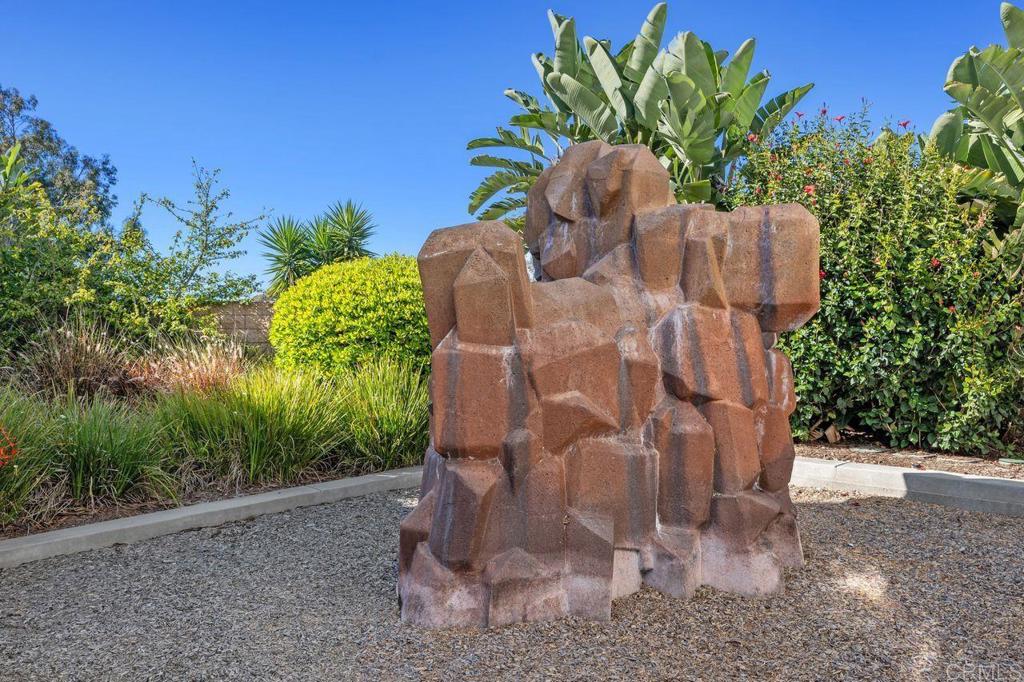 810 Harbor Cliff Way, Unit 225 Oceanside, CA 92054 - Photo 10 of 43 a potted plant sitting in front of a house