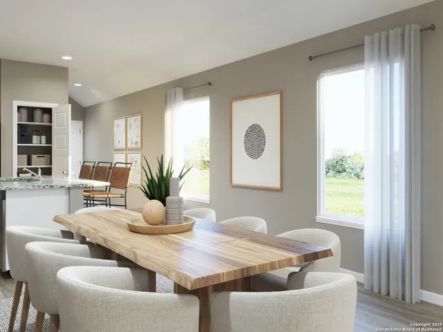 a dining room with furniture and window