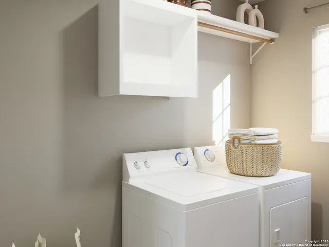 a utility room with dryer and washer