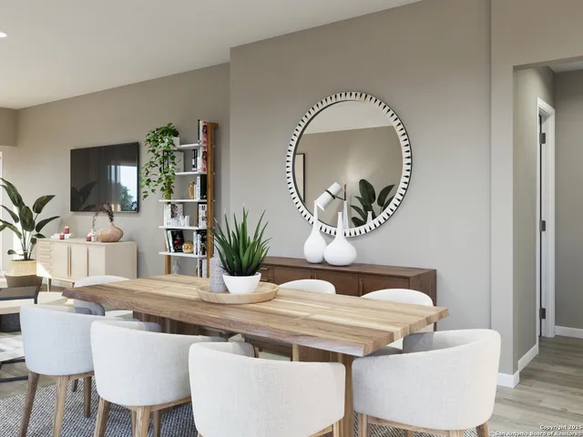 a dining room with furniture and wooden floor