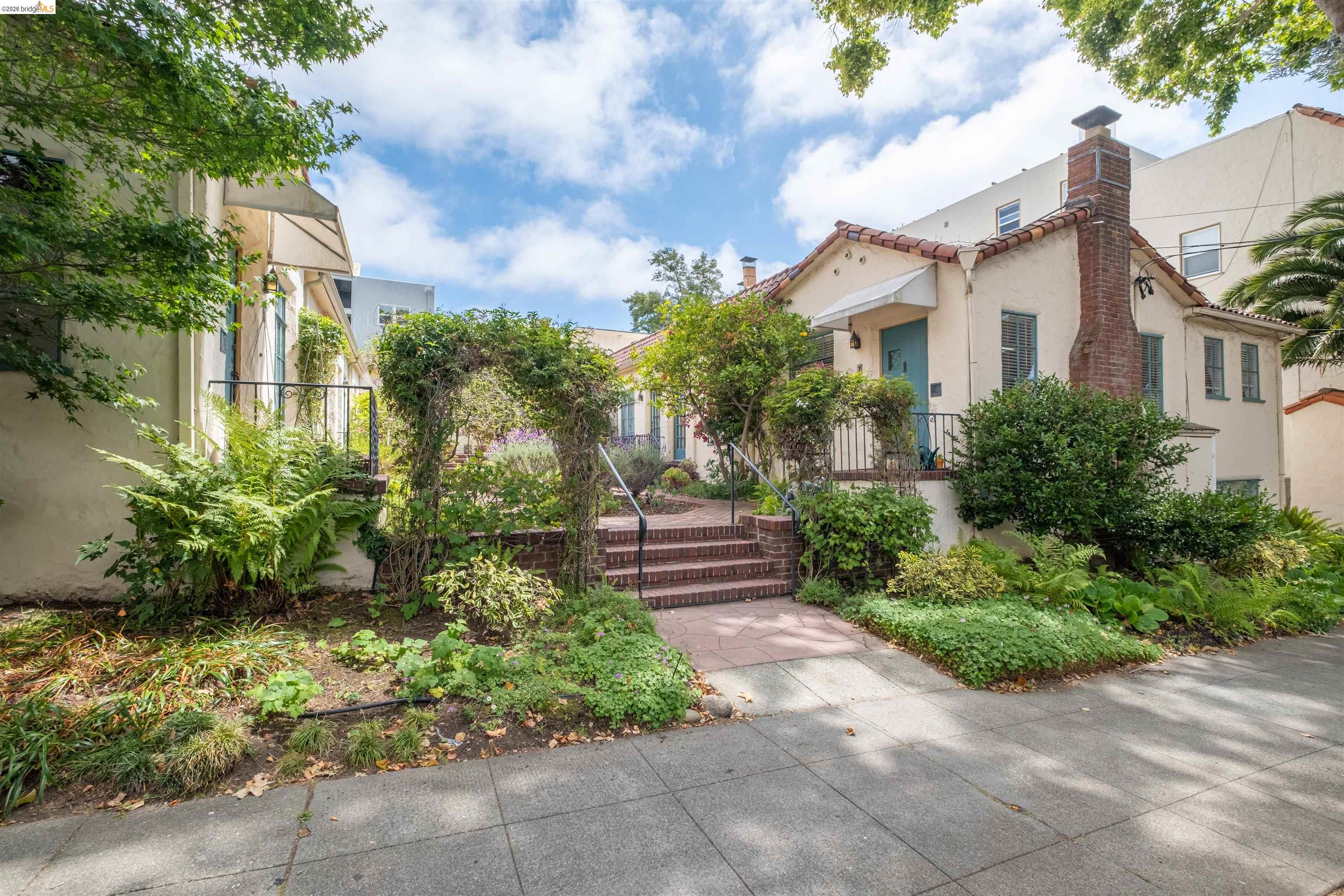 2444 Virginia Street, Unit B Berkeley, CA 94709 - Photo 9 of 39 Cream stucco exterior with a terra cotta tile roof