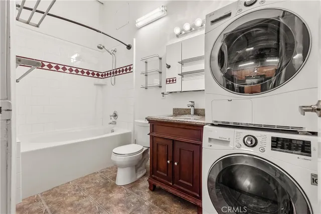a view of a storage & utility room with a washer and dryer