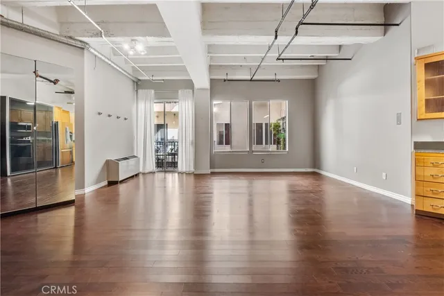 a view of an entryway with wooden floor