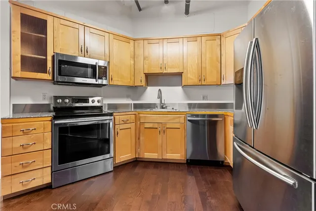 a kitchen with a stove microwave and a refrigerator