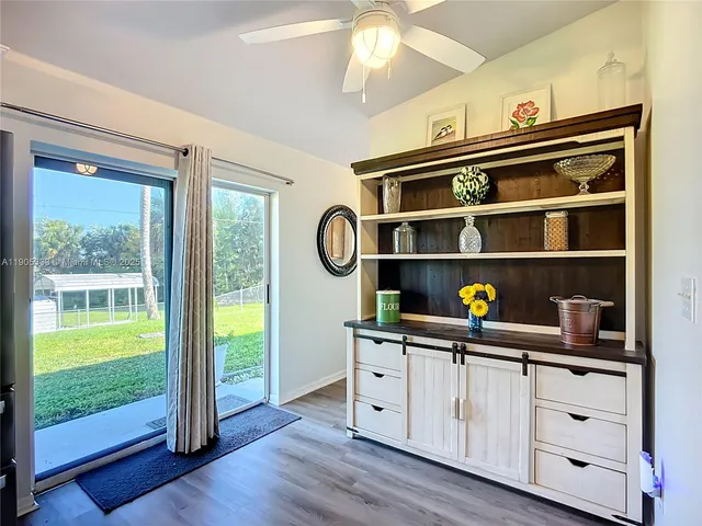a kitchen with a cabinets and window