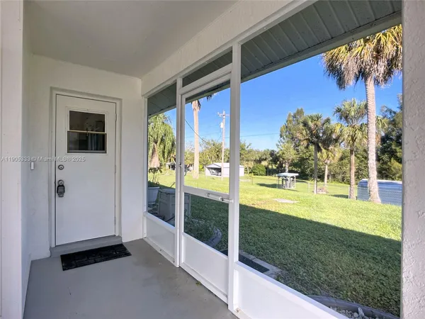 a view of a house with backyard from a tub