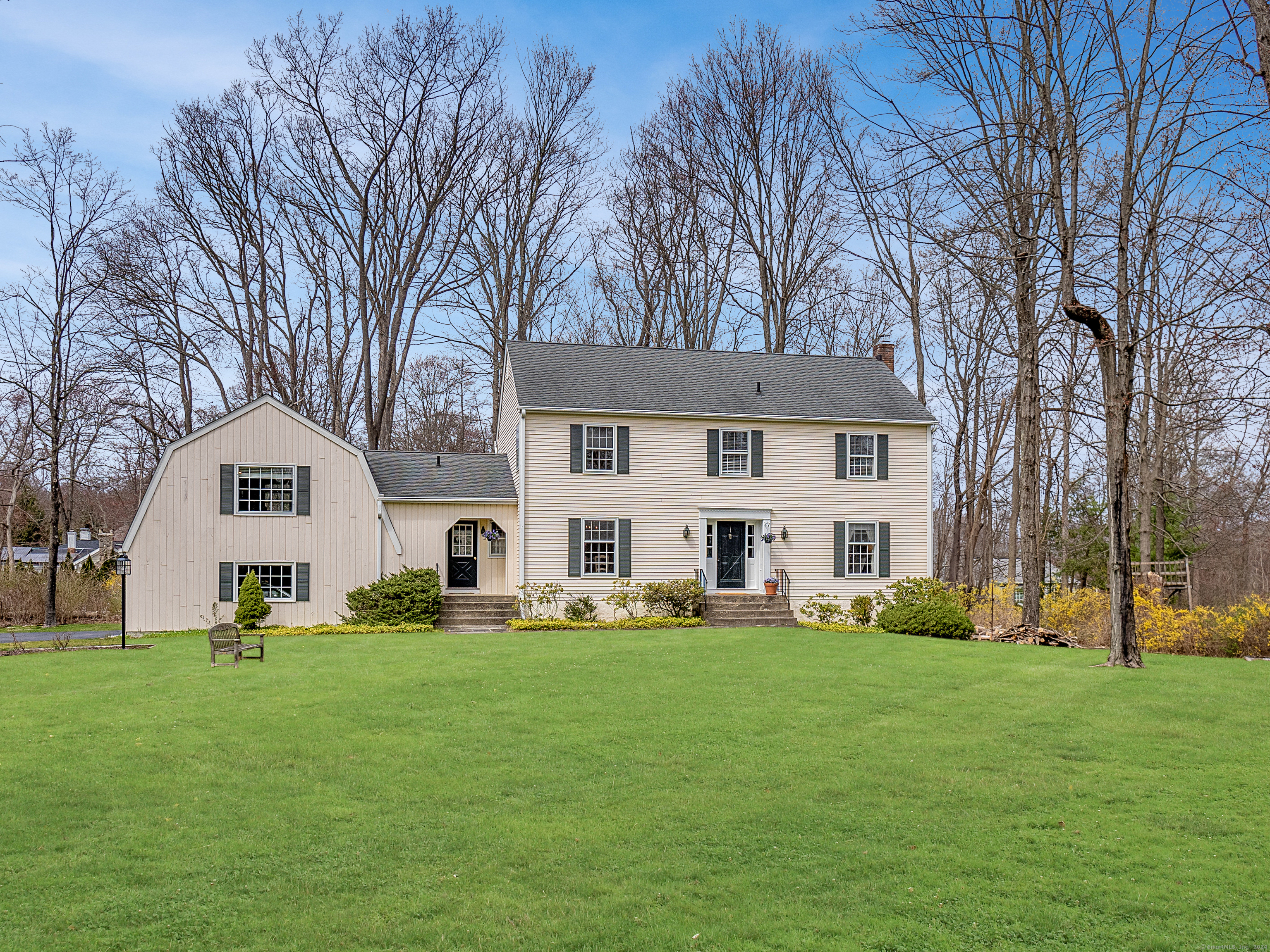 a front view of house with yard and green space