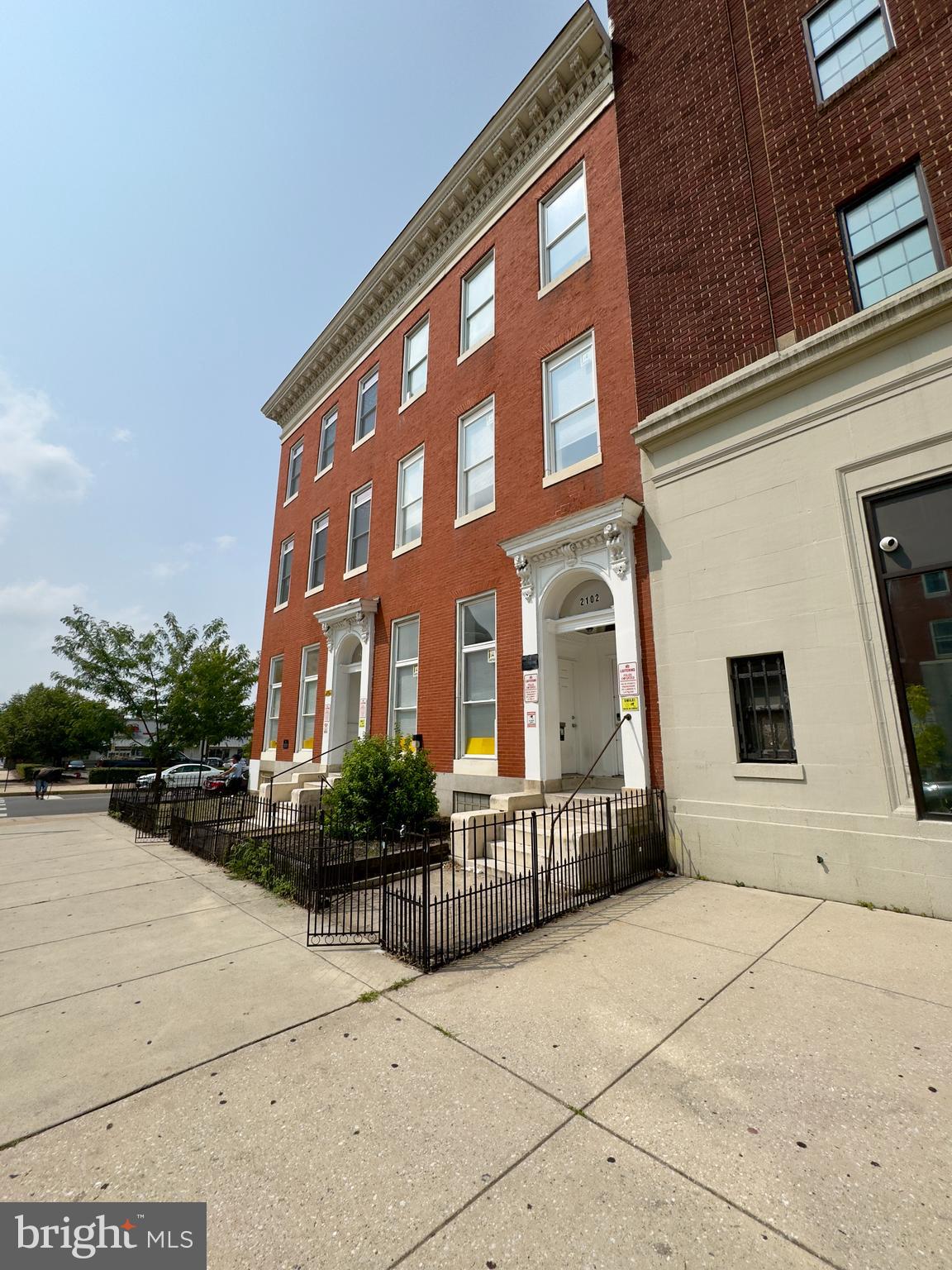 a view of a building with potted plants