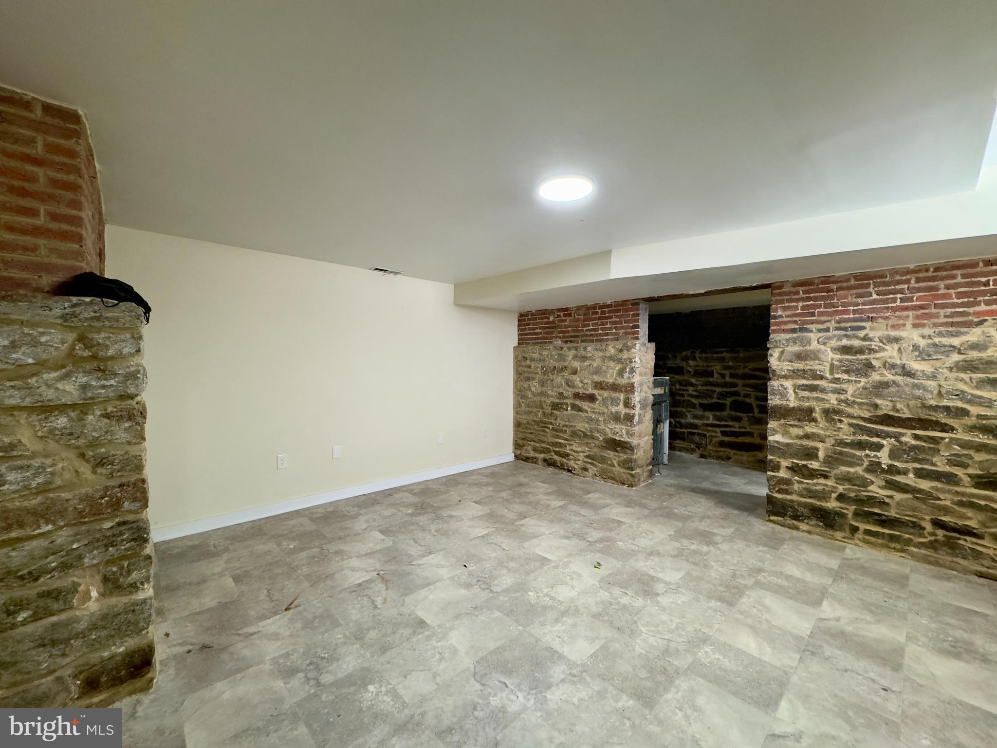 2102 Maryland Avenue Baltimore, MD 21218 - Photo 14 of 14 a view of empty room with fireplace