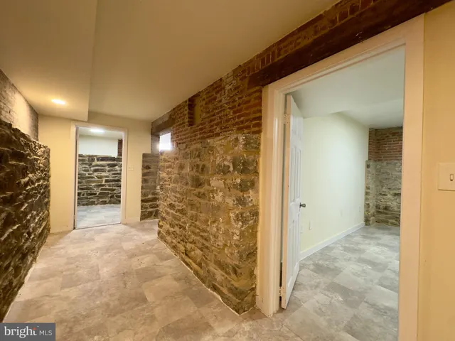 a view of room with walk in closet and window