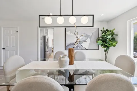 a bathroom with a sink mirror and vanity