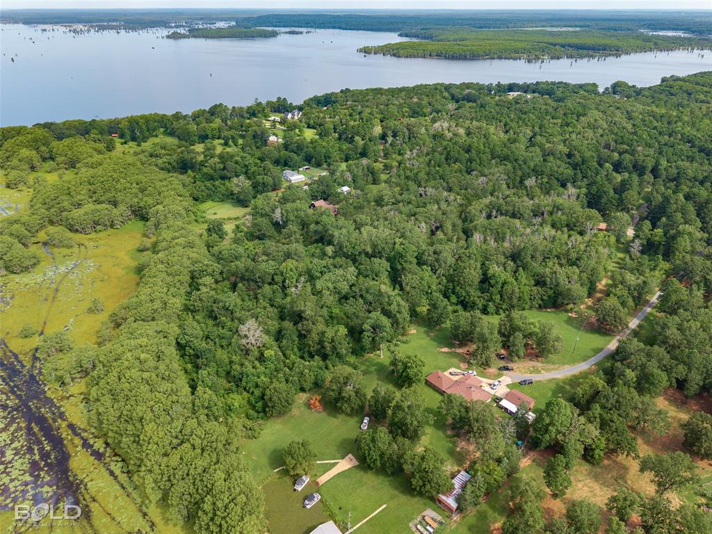 11015 Hereford Road Mooringsport, LA 71060 - Photo 14 of 18 Expansive waterfront property featuring a substantial body of water, extensive wooded areas, and cleared land