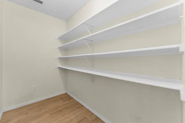 a view of an empty walk in closet