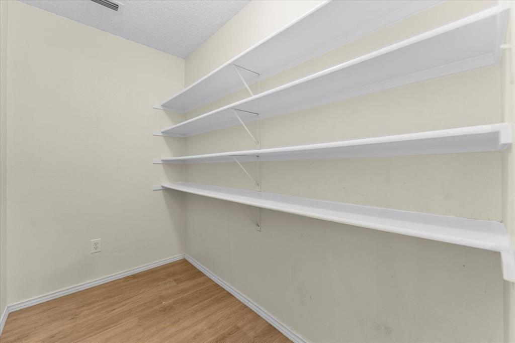 2633 Salt Maker Way Little Elm, TX 75068 - Photo 13 of 40 a view of an empty walk in closet