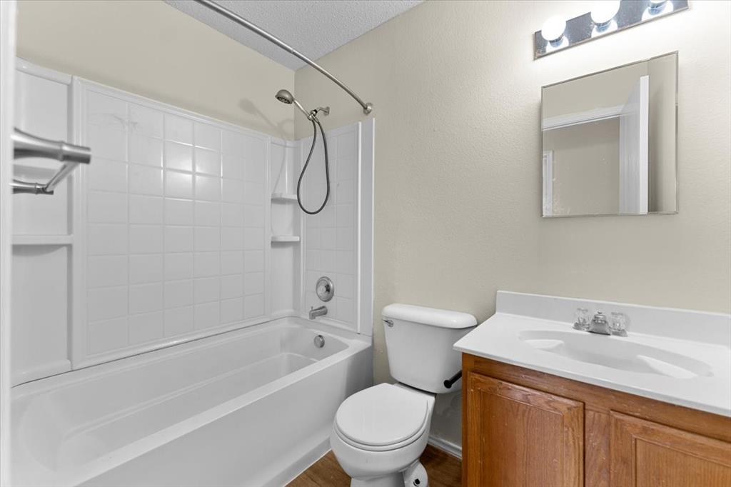 2633 Salt Maker Way Little Elm, TX 75068 - Photo 24 of 40 a bathroom with a sink toilet vanity and shower