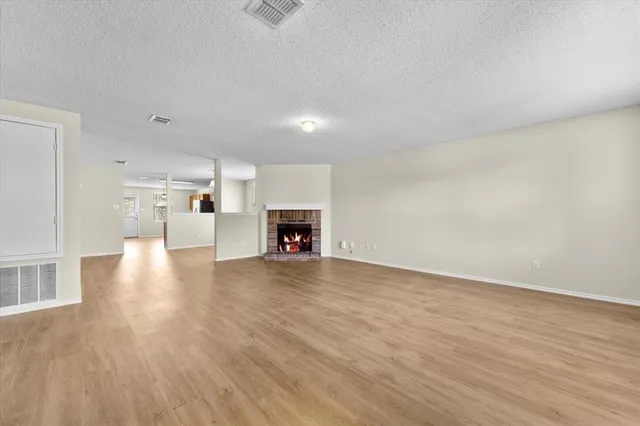 a view of a kitchen with a sink and a fireplace
