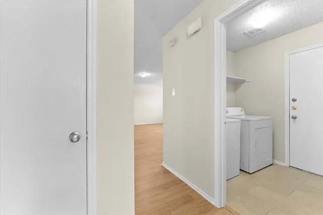 a view of a hallway with an empty room