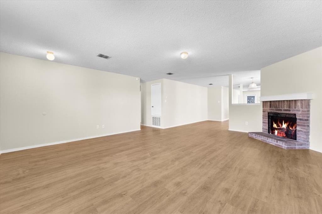 2633 Salt Maker Way Little Elm, TX 75068 - Photo 4 of 40 a view of a livingroom with a fireplace