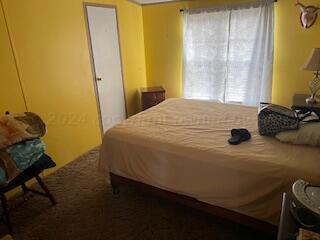 195 Busby Road Hereford, TX 79045 - Photo 11 of 19 a bedroom with a bed and teddy bear on bed