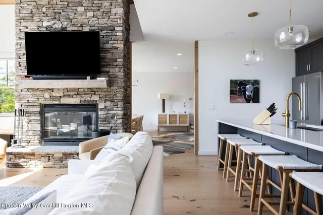 a kitchen with stainless steel appliances granite countertop a sink a stove and a oven