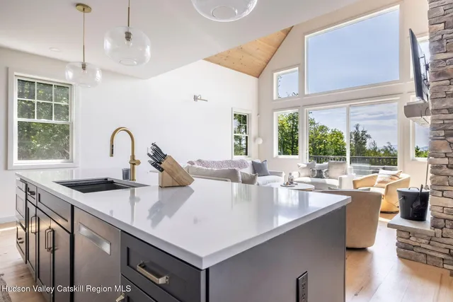 a dining room with furniture window and wooden floor